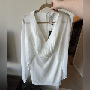 Halston white dress size ten never worn with tags.